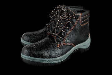 Image showing moist modern working boots 