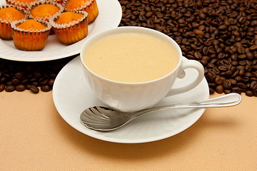 Image showing White cup of coffee and coffee beans