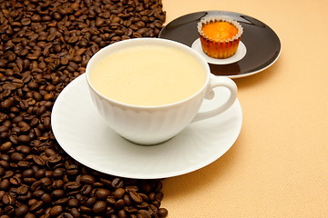 Image showing White cup of coffee and coffee beans