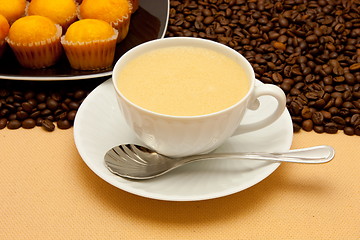 Image showing White cup of coffee and coffee beans