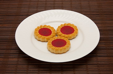 Image showing plate of cookies on dark brown background