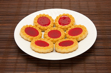 Image showing plate of cookies on dark brown background