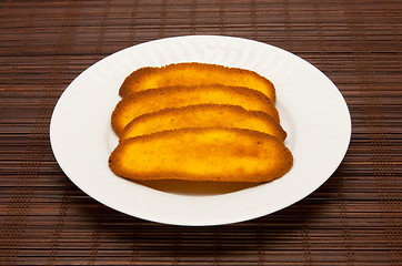 Image showing plate of cookies on dark brown background
