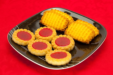 Image showing plate of cookies on red background