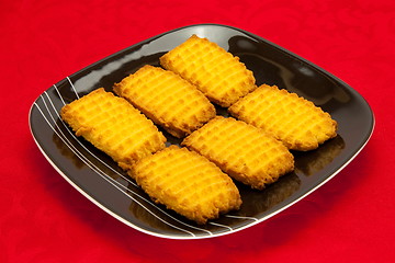 Image showing plate of cookies on red background