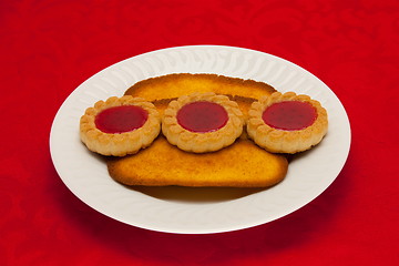 Image showing plate of cookies on red background