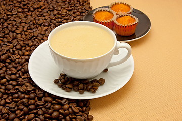 Image showing White cup of coffee and coffee beans