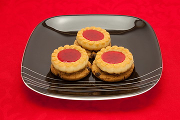 Image showing plate of cookies on red background