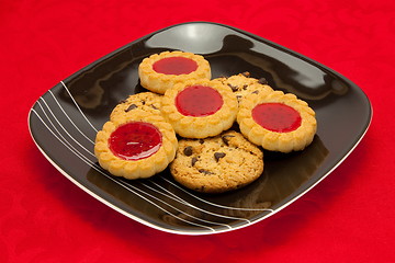 Image showing plate of cookies on red background