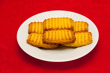 Image showing plate of cookies on red background