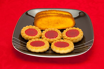 Image showing plate of cookies on red background