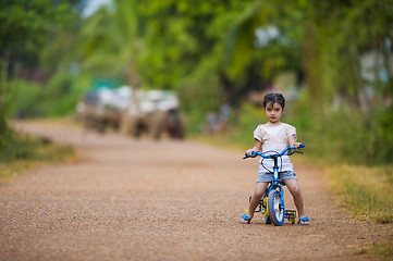 Image showing cute girl riding her bike