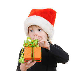 Image showing The child in a hat santa claus