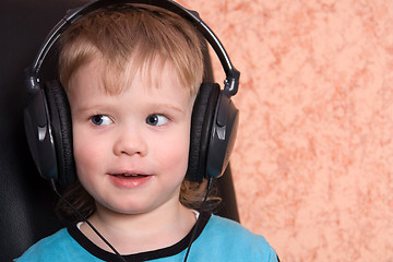Image showing child in ear-phones