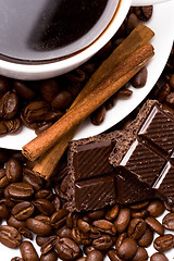 Image showing cup of coffee, beans, cinnamon