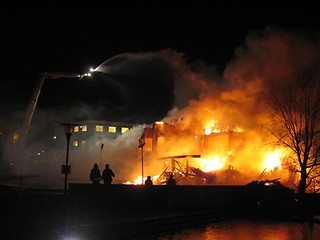 Image showing Firefighters putting out burning house.