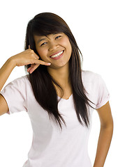 Image showing young beautiful asian woman showing call sign