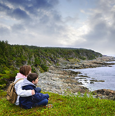 Image showing Children sitting at Atlantic coast in Newfoundland