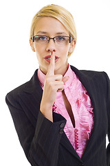 Image showing businesswoman with her finger on her lips