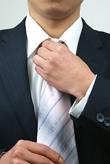 Image showing DOING A TIE