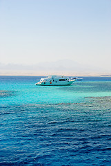 Image showing Yacht in sea with coral reefs