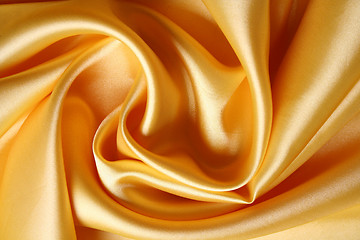 Image showing Smooth elegant golden satin as background 