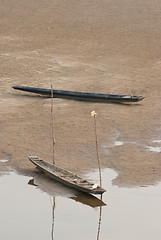 Image showing Two boats on the riverbed of Mekong