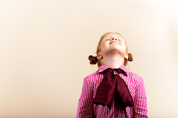 Image showing Portrait of cute elegant redhead girl looking up closed eyes