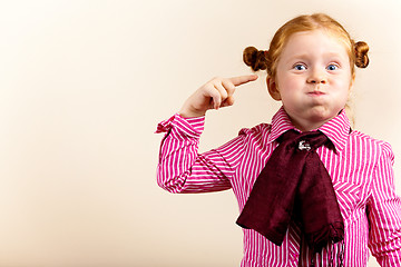 Image showing Portrait of cute elegant redhead girl blowing cheeks