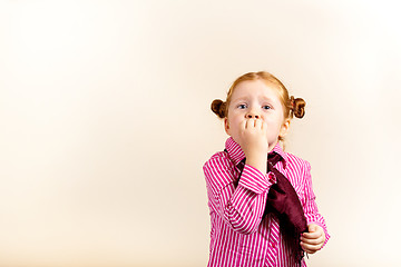 Image showing Portrait of cute elegant redhead girl mouth covered with hand