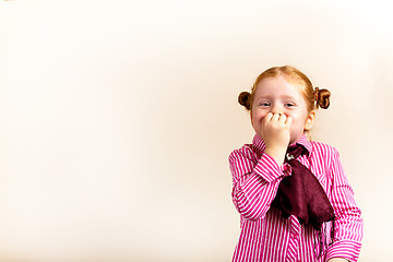 Image showing Portrait of cute elegant redhead girl mouth covered with hand