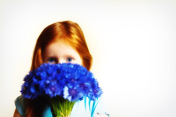 Image showing Portrait of redhead girl with cornflowers