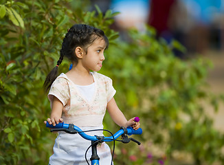 Image showing cute girl on her bike