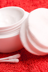 Image showing cotton pads and facial creme