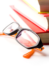 Image showing stack of books and glasses