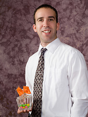 Image showing Man with candy dish