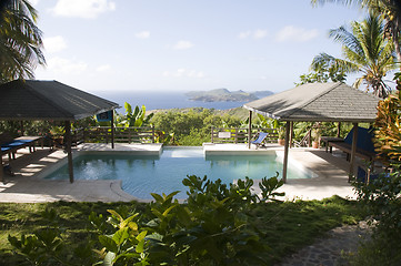 Image showing caribbean island villa pool with lovely view of grenadine island