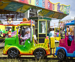 Image showing Little girl in amusement park