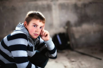 Image showing Handsome teenaiger looking self assured at camera portrait added glow