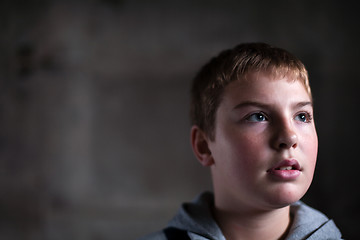 Image showing Young boy looking up with hope in his eyes  copy space