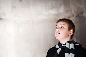 Image showing Young boy looking up with hope in his eyes  copy space