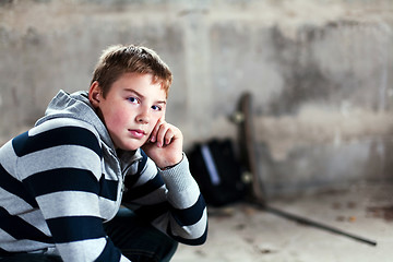 Image showing Handsome teenaiger looking self assured at camera portrait