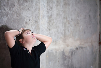 Image showing Young boy looking up with hope in his eyes