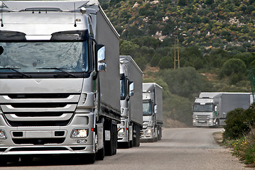 Image showing Silver trucks convoy