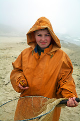 Image showing Boy with fisherman's coat