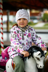 Image showing Little girl in amusement park