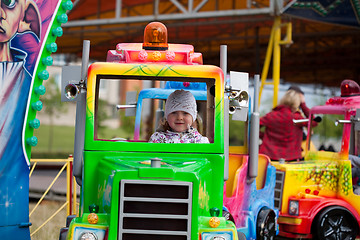 Image showing Little girl in amusement park