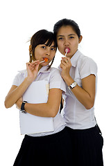 Image showing beautiful students with lollipops
