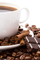 Image showing cup of coffee, beans, cinnamon