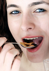 Image showing Young people eating milk with cereals